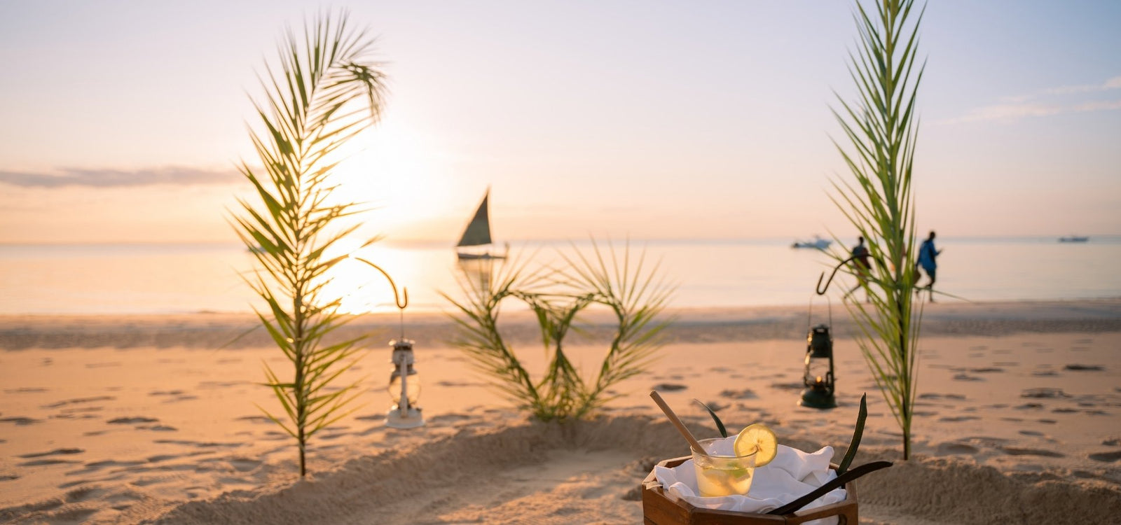 Azura Benguerra Cocktails on the beach, sailing boat in background